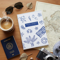Travel journal cover with blue sea-themed illustrations on a white background
