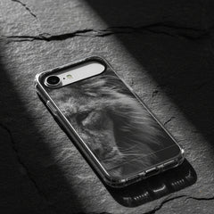 Phone case with a black and white lion design on a light gray background