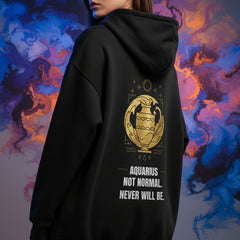 Black hoodie with yellow Aquarius zodiac design and text on a white background