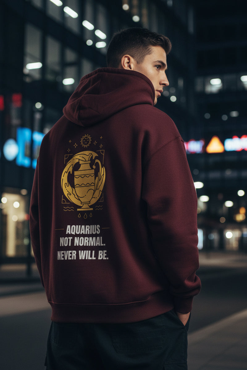 Maroon hoodie with yellow Aquarius zodiac design and text on a white background