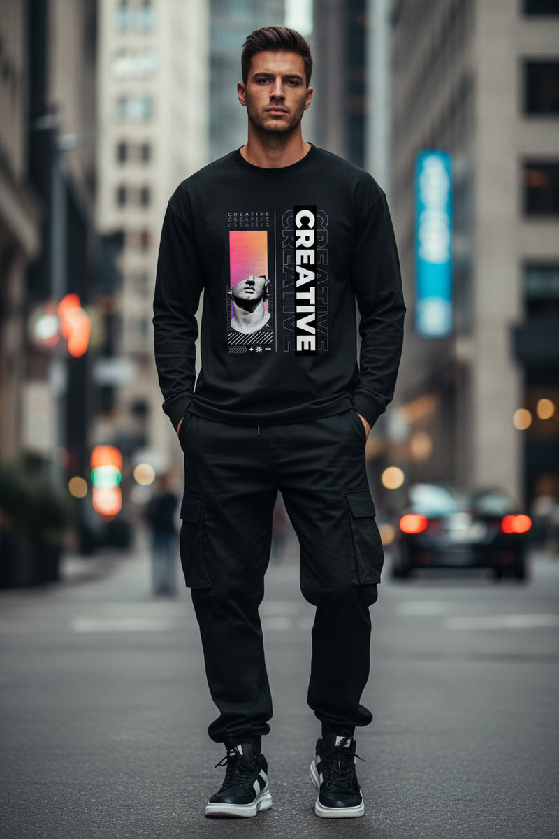Black long-sleeve shirt with artistic design and 'CREATIVE' text on a white background