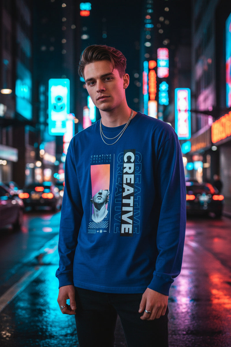 Navy blue long-sleeve shirt with artistic design and 'CREATIVE' text on a white background