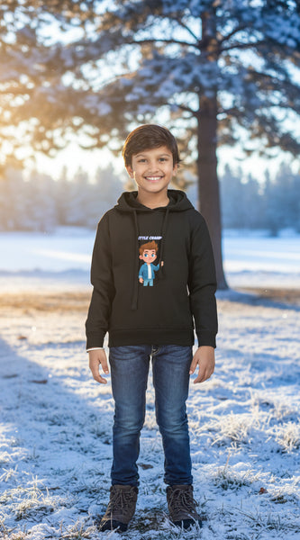 Child wearing a black hoodie with a cartoon character and text on a white background