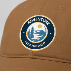 Brown cap with 'Adventure into the Wild' logo on a light gray background