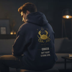 Navy blue hoodie with yellow crab design and text on the back against a light gray background