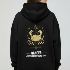 Black hoodie with yellow crab design and text on a white background