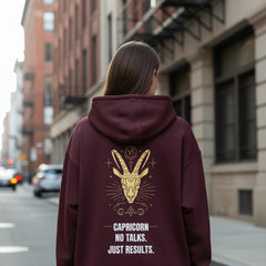 Maroon hoodie with a crab design and text on the back against a white background