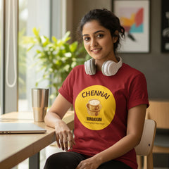 Red t-shirt with a yellow circular design featuring 'Chennai' and 'Vanakkam' on a white background