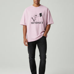 Pink t-shirt with a graphic and 'MINDSET' text on a white background