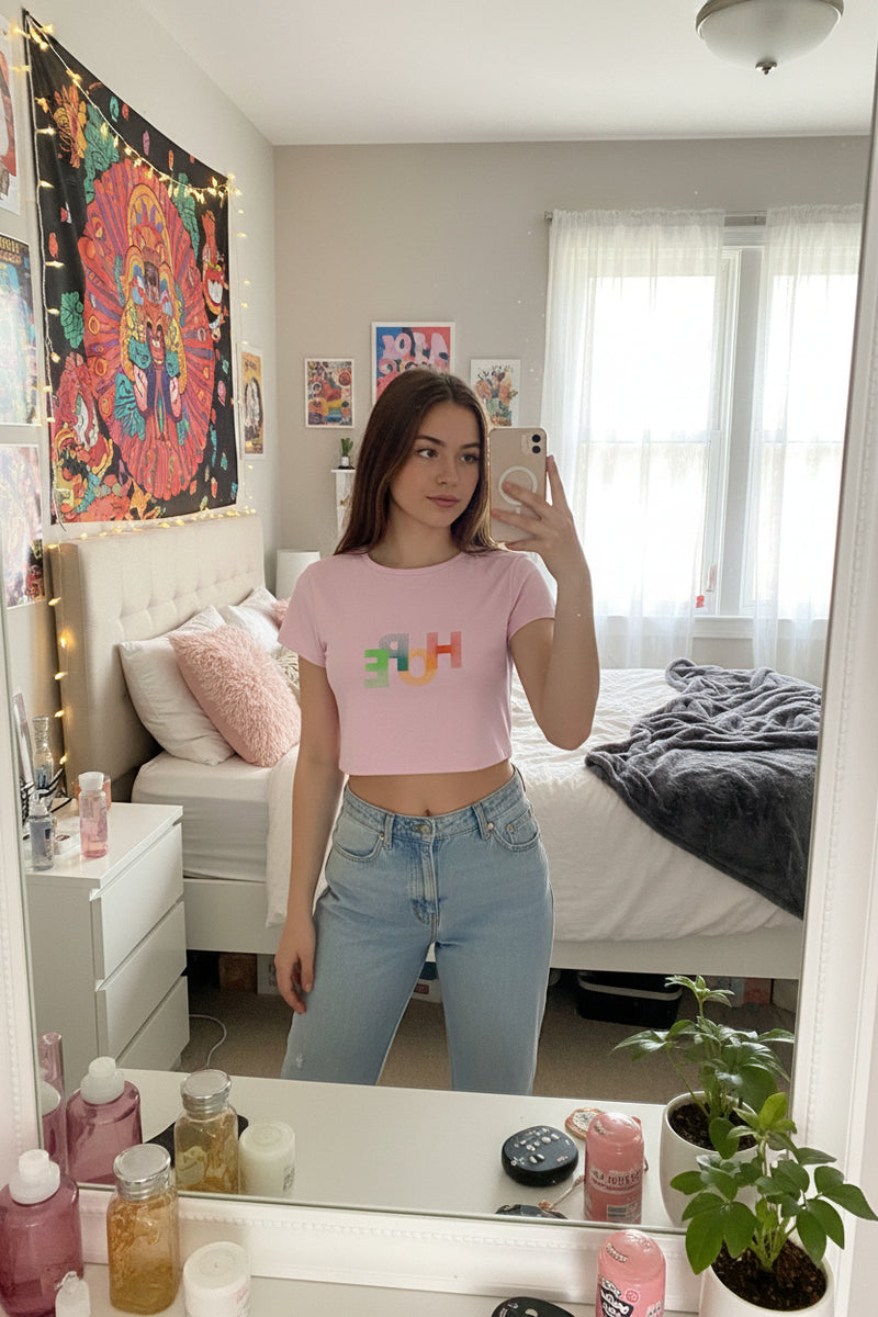 Pink t-shirt with 'HOPE' in colorful letters on a white background