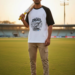 Black and white baseball shirt with 'Cricket Loading' graphic on a white background