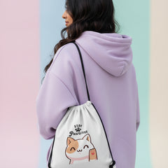 Drawstring bag with a cat illustration and 'Stay Pawsitive' text on a light background