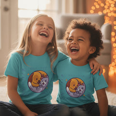 Sky Blue t-shirt with a cartoon design of a dog and cat on a white background