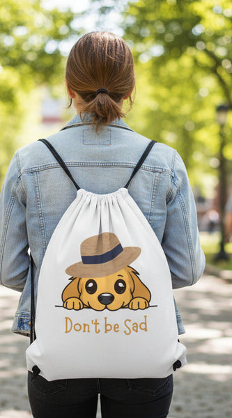 Cartoon dog wearing a hat with 'Don't be Sad' text on a white background