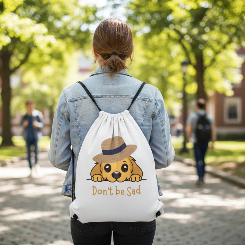 Cartoon dog wearing a hat with 'Don't be Sad' text on a white background