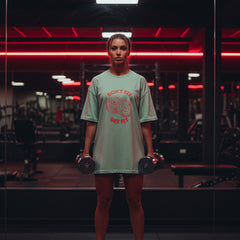 Green t-shirt with red graphic and text on a white background
