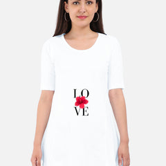 Woman wearing a white Maternity Dress  with 'LOVE' and a red flower design on a plain background