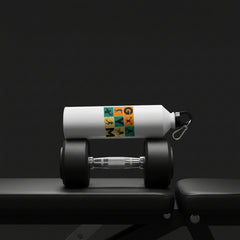 White water bottle with gym-themed design on a table with a greenery background