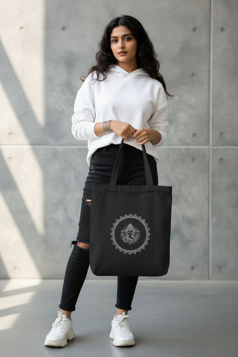 Black tote bag with 'No Pain, Just Gain' text held by a person against a gray background