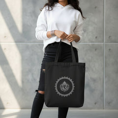 Black tote bag with 'No Pain, Just Gain' text held by a person against a gray background
