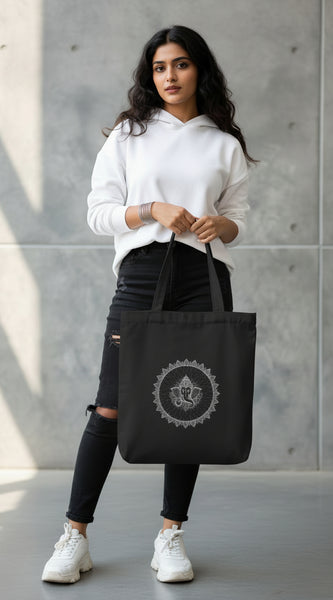 Black tote bag with 'No Pain, Just Gain' text held by a person against a gray background