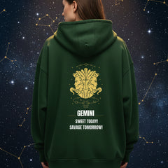 Green hoodie with gold and white design on the back