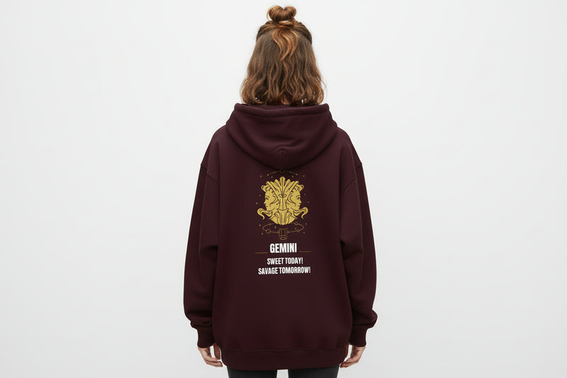 Maroon hoodie with yellow astrological design and text on a white background