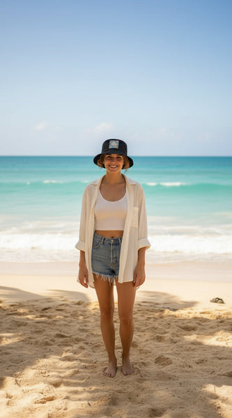 Black bucket hat with a colorful pineapple design on a white background