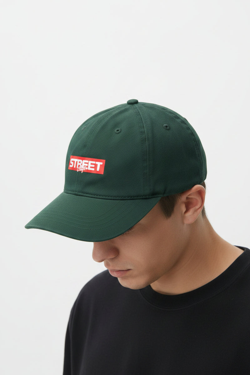 Green with a red and white logo on a light gray background
