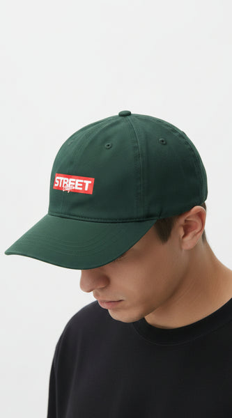 Green with a red and white logo on a light gray background