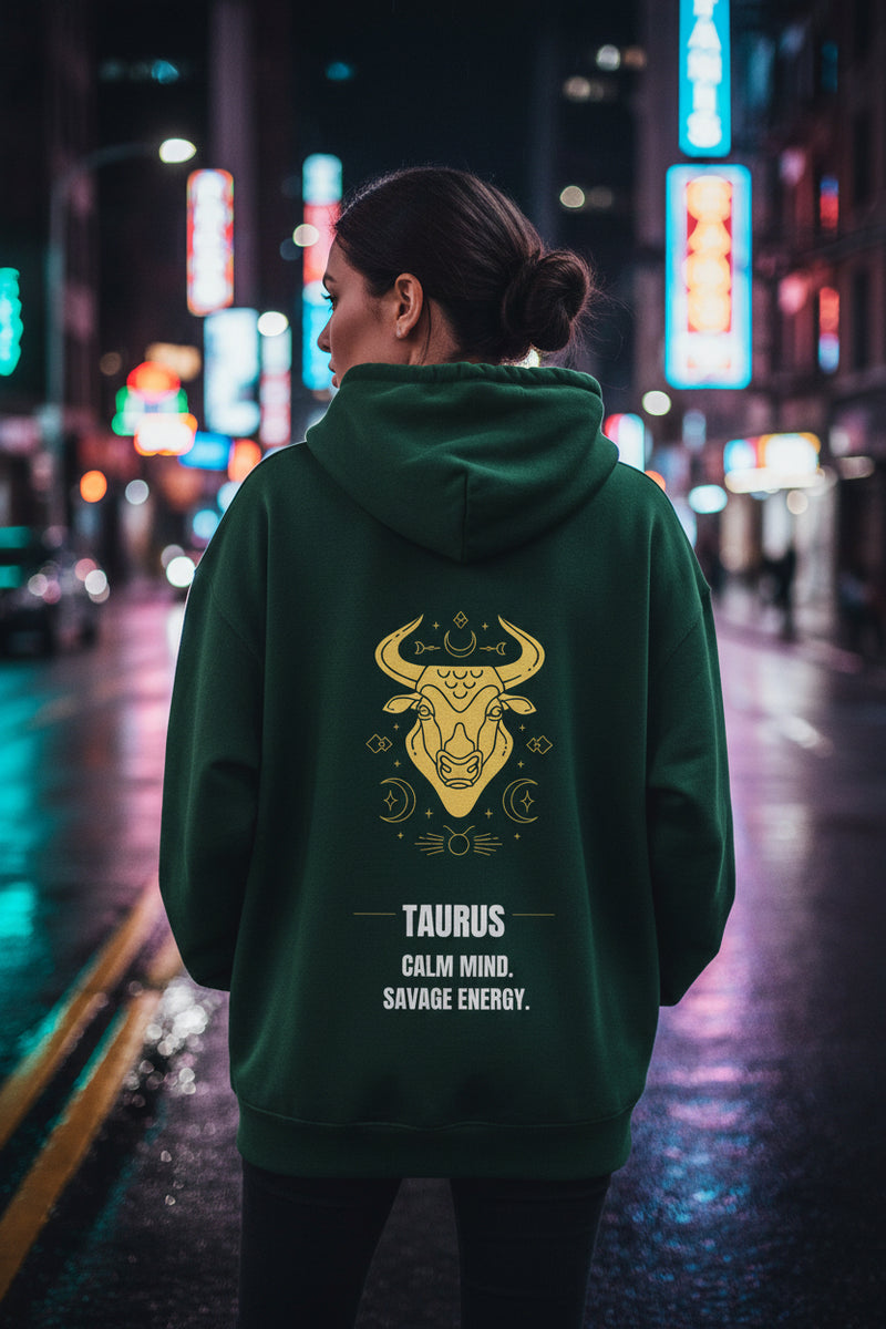 Green hoodie with Taurus zodiac design on the back against a white background