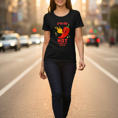 Woman wearing a black t-shirt with a red pepper graphic and text.