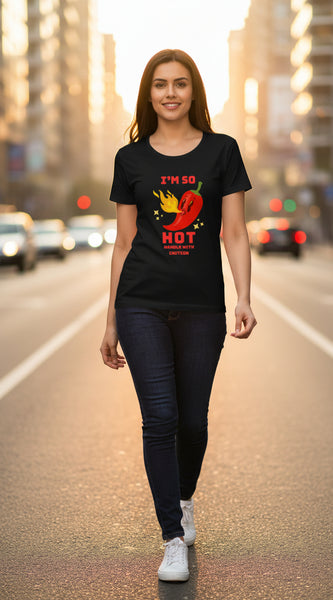 Woman wearing a black t-shirt with a red pepper graphic and text.