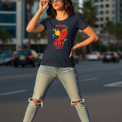 Woman wearing a blue t-shirt with a red pepper graphic and text.