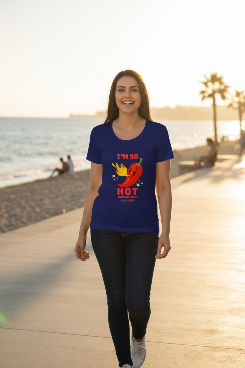 Woman wearing a royal blue t-shirt with a red pepper graphic and text on a white background