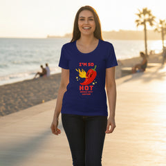 Woman wearing a royal blue t-shirt with a red pepper graphic and text on a white background