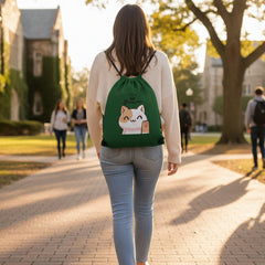 Green drawstring bag with a cat illustration and 'Stay Positive' text on a light gray background
