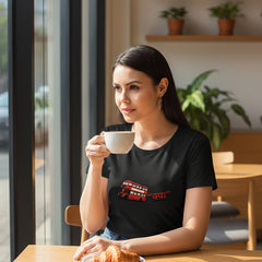 Woman wearing a black t-shirt with a red graphic design on a white background