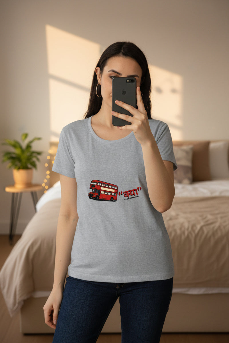 Woman wearing a gray t-shirt with a red double-decker bus graphic on a white background