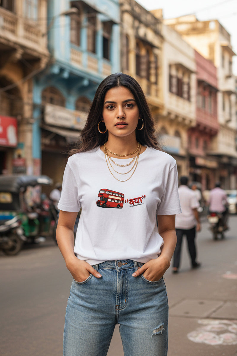 Woman wearing a white t-shirt with a red double-decker bus graphic and text on a white background