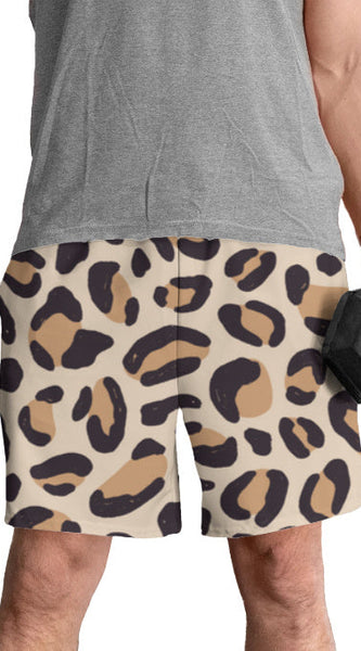 Person wearing leopard print shorts holding a dumbbell on a white background