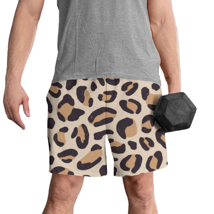 Person wearing leopard print shorts holding a dumbbell on a white background