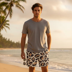 Person wearing leopard print shorts and a blue top, holding a soccer ball.