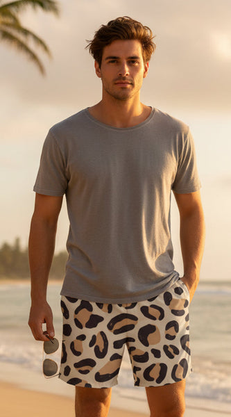 Person wearing leopard print shorts and a blue top, holding a soccer ball.