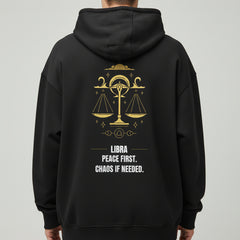 Black hoodie with Libra zodiac design and text on a white background