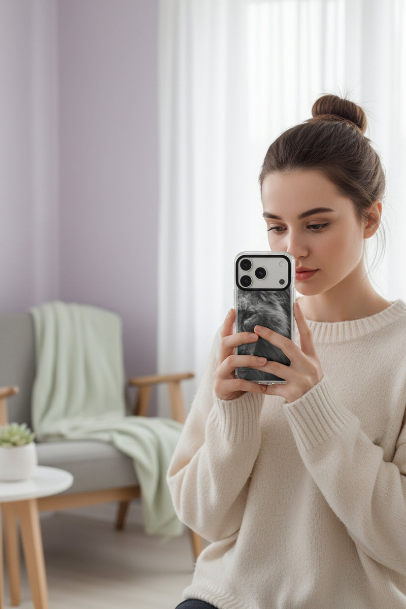 Phone case with a black and white lion design on a light gray background