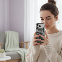 Phone case with a black and white lion design on a light gray background