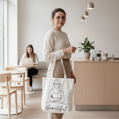 Tote bag with a line drawing of a woman and the word 'Beautiful' on a white background.