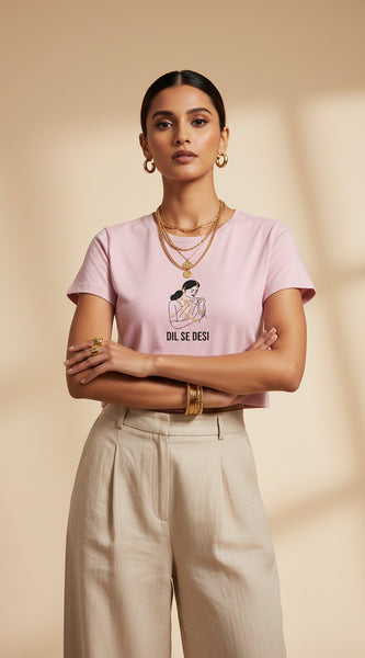 Pink t-shirt with graphic and text on a white background