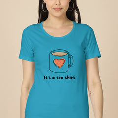Woman wearing a blue t-shirt with a tea cup design and text.